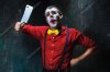 depositphotos_124939772-stock-photo-the-scary-clown-holding-a.jpg